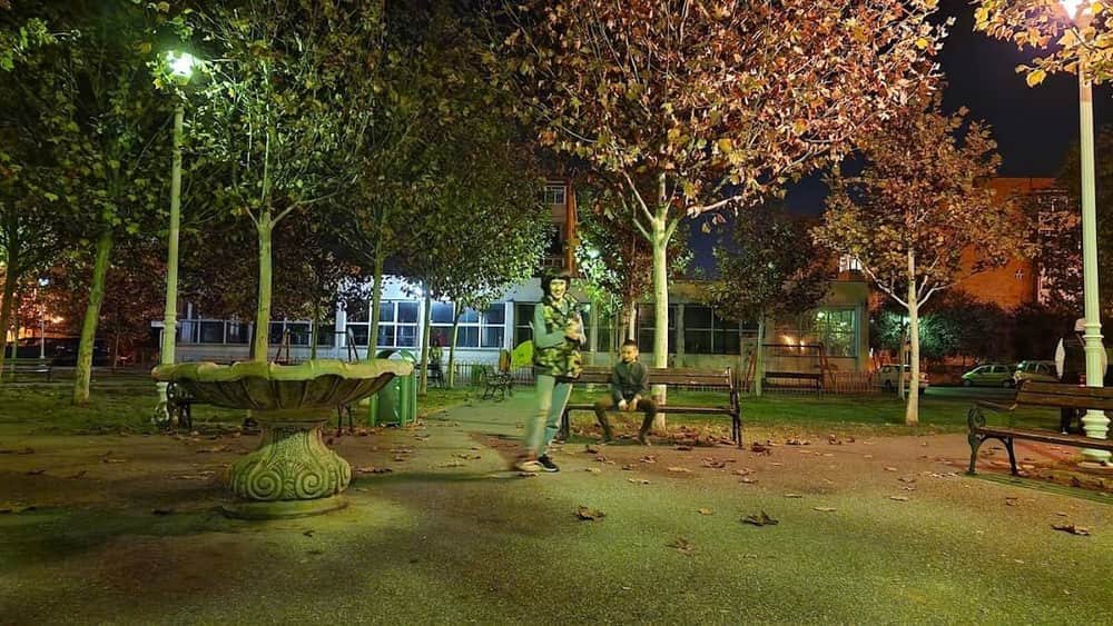 Landscaped park with benches and playground for children — 2